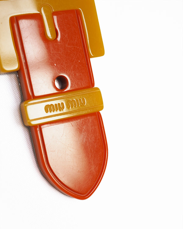 MIU MIU BUCKLE BROOCH Abstracted buckle shaped yellow and orange embossed resin brooch.