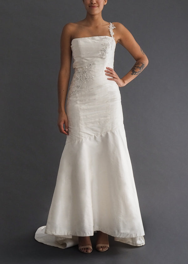 Alfred Sung single strap, A-line gown in off white silk with silver floral embroidery detail.