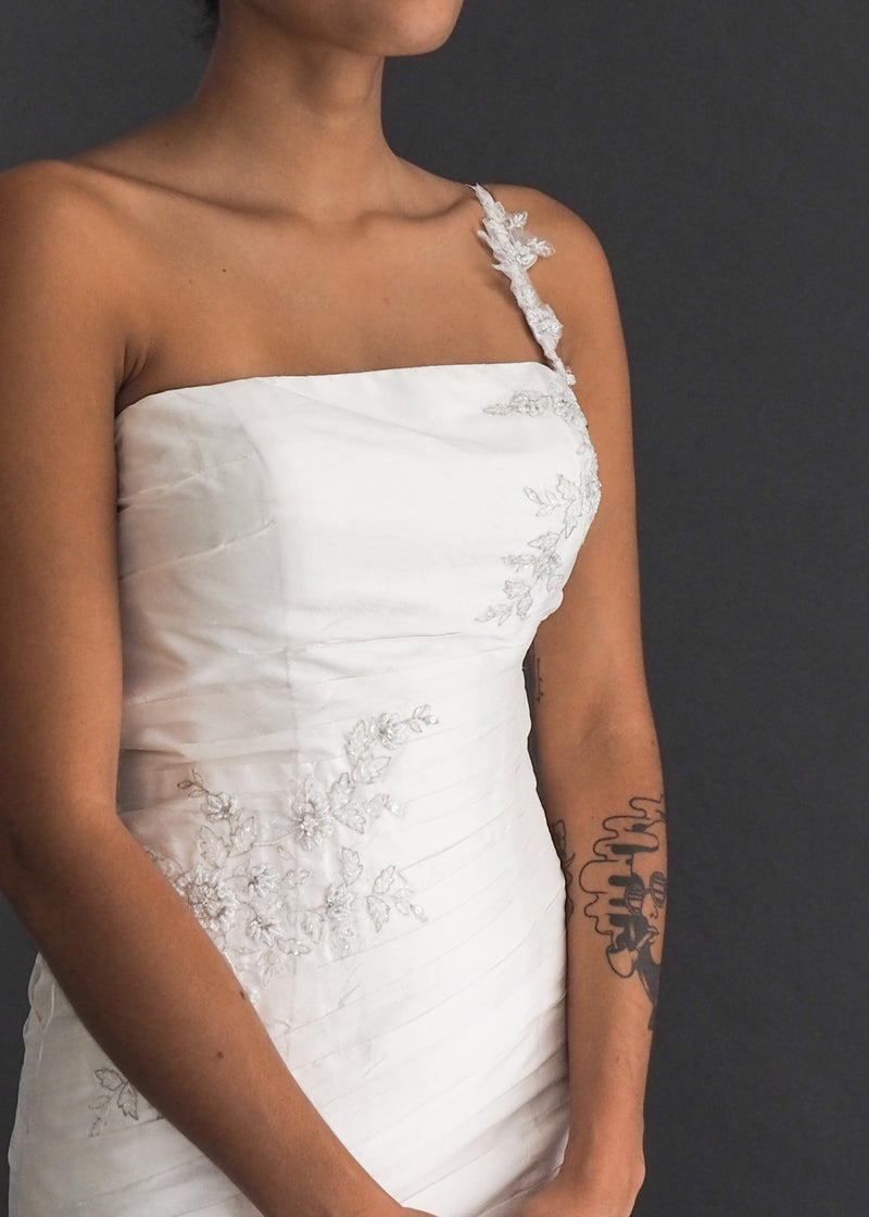 Alfred Sung single strap, A-line gown in off white silk with silver floral embroidery detail.