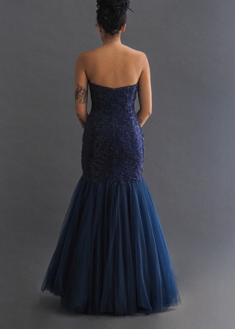 Navy gown with sweetheart neckline, dropped sequin bodice and tulle mermaid skirt