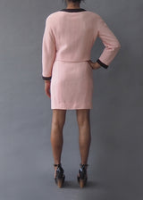 CHANEL SKIRT SUIT Classic pink vintage Chanel skirt suit including signature cord buttons and contrast cord trim and detailing.