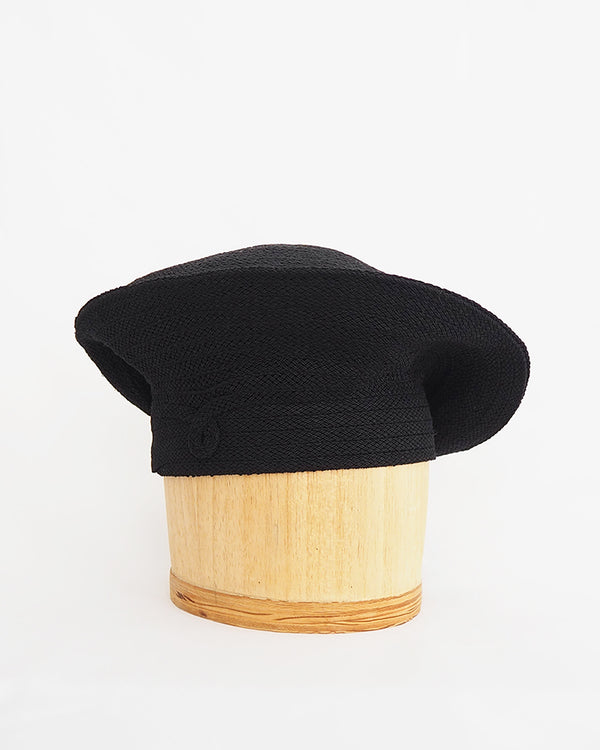 Renata Crowe , milliner to the brave- black woven textile, beret-style hat.