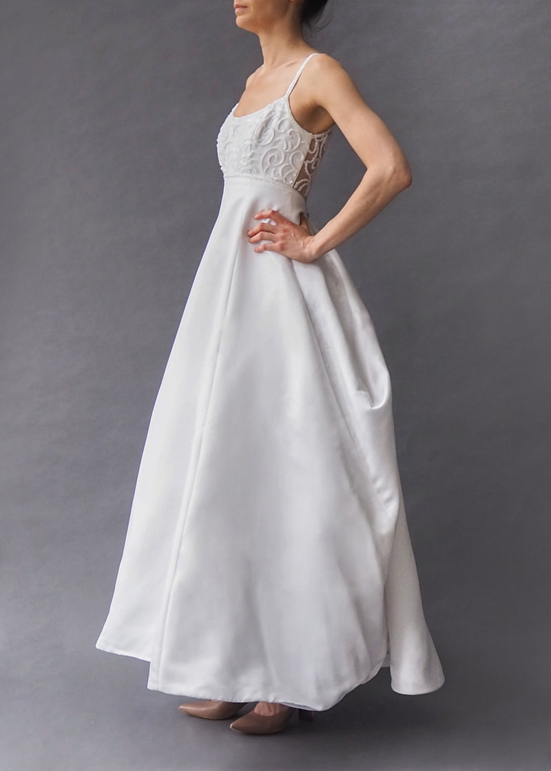 DEMETRIOS BRIDAL GOWN Pristine white heavy beaded bodice, full skirted bridal gown with train and button closure.