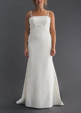 Dere Kiang simple A-line bridal gown with pearl empire waist and strap detail.