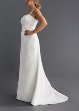 Dere Kiang simple A-line bridal gown with pearl empire waist and strap detail.