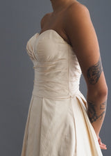 Martina Liana  silk strapless ballgown-style wedding dress with ruched bodice, pockets and full train. 