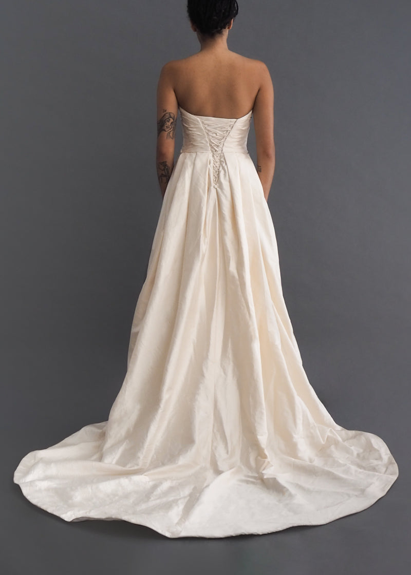 Martina Liana  silk strapless ballgown-style wedding dress with ruched bodice, pockets and full train. 