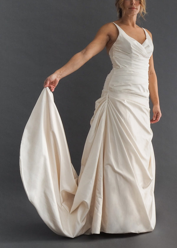 Mikaella eggshell coloured bridal gown with v-neck gathered bodice and ruched skirt including convertible train.