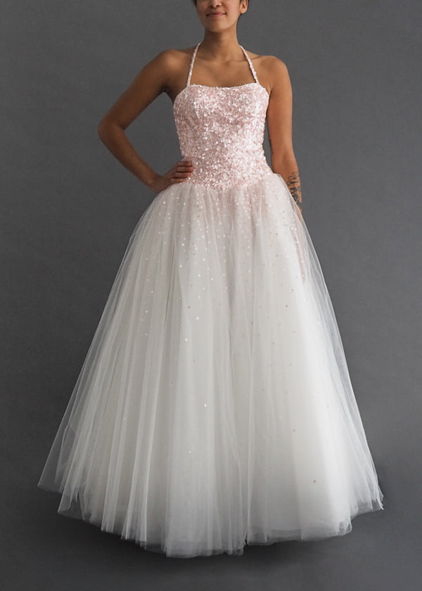 Moira Lee halter neck  ball-gown with baby pink sequin bodice and spray onto full tulle skirt.