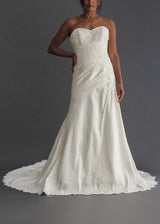 MOIRA LEE STRAPLESS BRIDAL GOWN Strapless ivory A-line gown with lace and beaded applique and dramatic train.