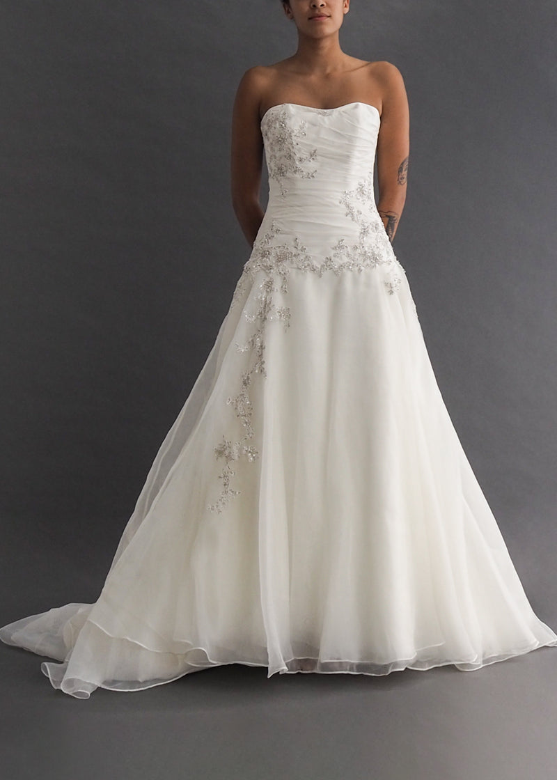 MOIRA LEE BY MADELINE GARDNER - sweetheart bridal gown Strapless, off-white, A-line gown with silver floral embroidery on gathered bodice and accentuating train.