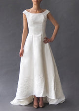 PALOMA BLANCA - bridal gown White satin off-the-shoulder A-line gown with subtle cord embroidery and faux button zip closure.