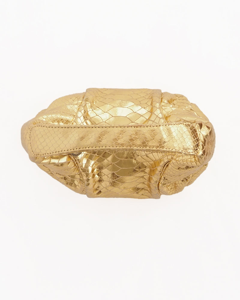 DONALD J. PLINER BAGUETTE PURSE Gold snakeskin baguette-style mini purse with zip closure.