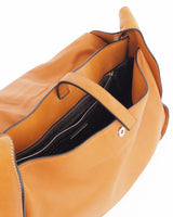 PRADA PURSE Buttery soft caramel colored leather shoulder bag with flap-front ring closure. 