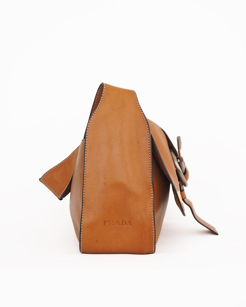 PRADA PURSE Buttery soft caramel colored leather shoulder bag with flap-front ring closure. 