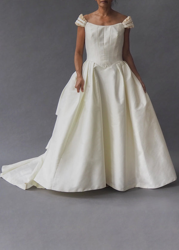 PRONOVIAS - rosebud ballgown  Buttercream princess style bridal gown with full skirt, pink rosebud detailed drop shoulder straps, simple zip closure and dramatic train.