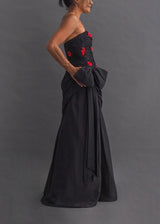 TERENCE NOLDER LONDON - asymmetrical strapless gown Strapless black taffeta gown with metallic thread and red ribbon embroidery plus giant 80's bow attaching an asymmetrical sash.