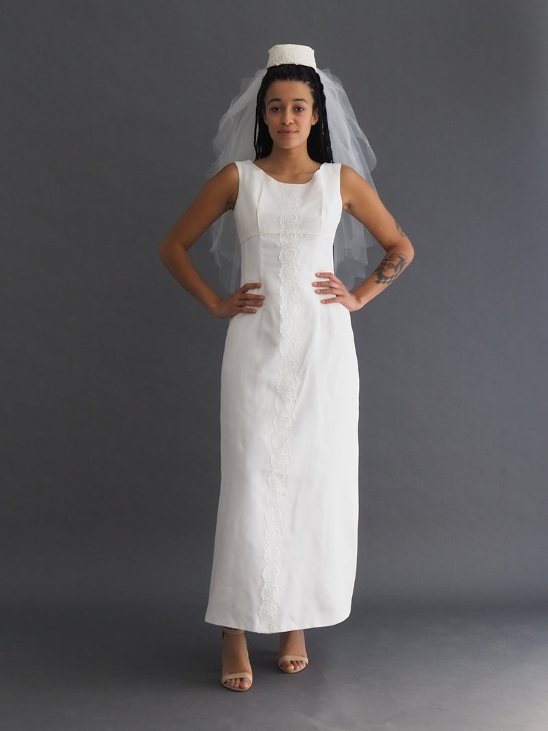 Vintage 1950's ankle-length sleeveless a-line dress with lace stripe detail including removable bolero train and veil headpiece.