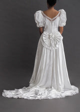 ZURCOIN METHOD PRESTIGE - 80's puff-sleeve bridal gown Vintage satin puff-sleeve gown with lace appliqué and pearl beading, excessive train and detachable bow bustle.