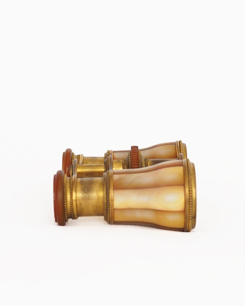 Le Maire Paris Opera Glasses Antique French opera glasses with blush mother-of-pearl inlay and adjustable brass / bakelite fittings and focus dials. The name 'Amelia' is engraved on the brass casing.