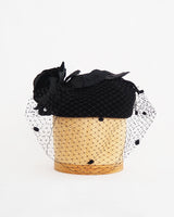 André black velvet fascinator with black floral applique and net veil.